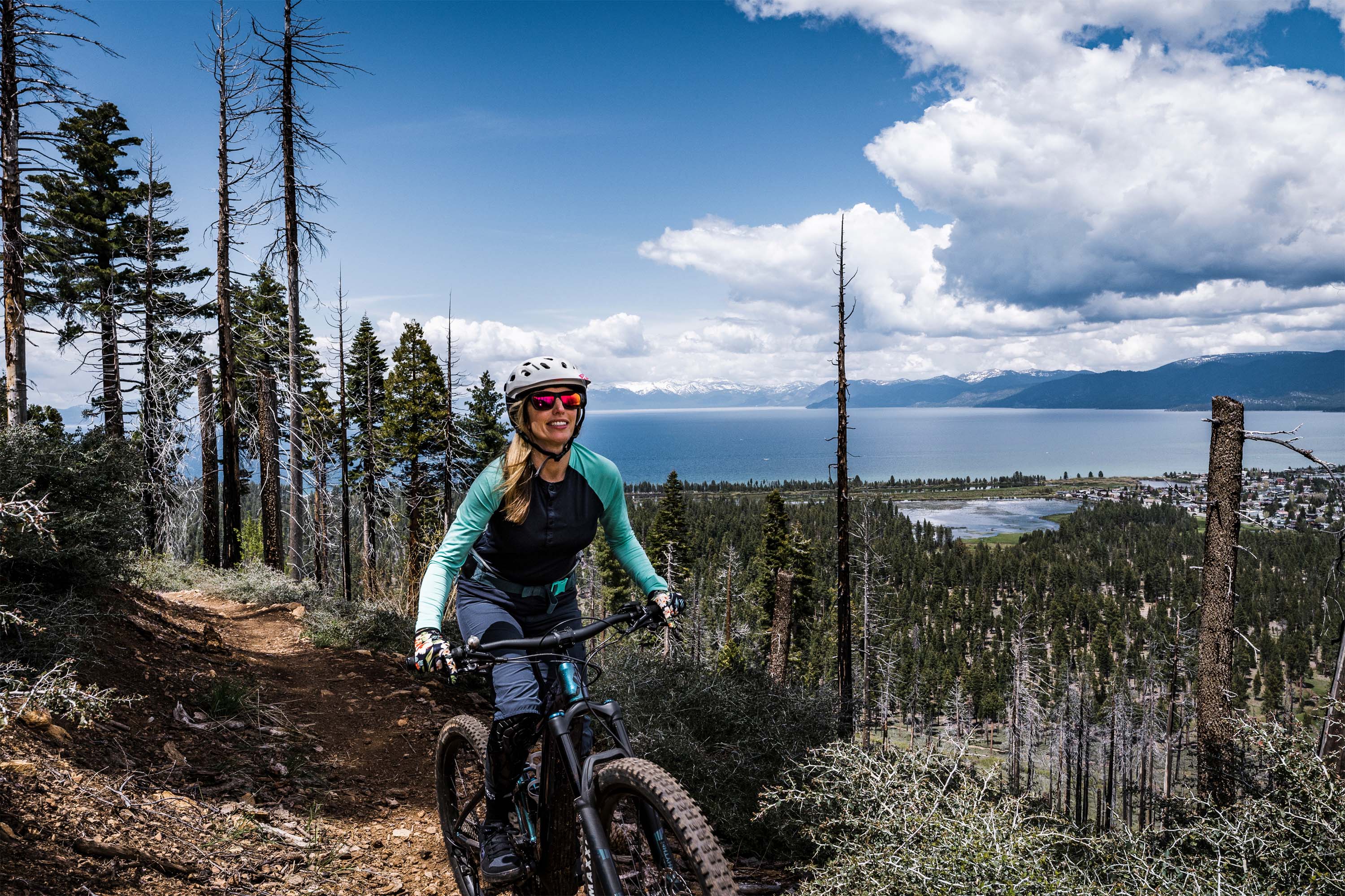 Mountain biker coming down hill above Lake Tahoe