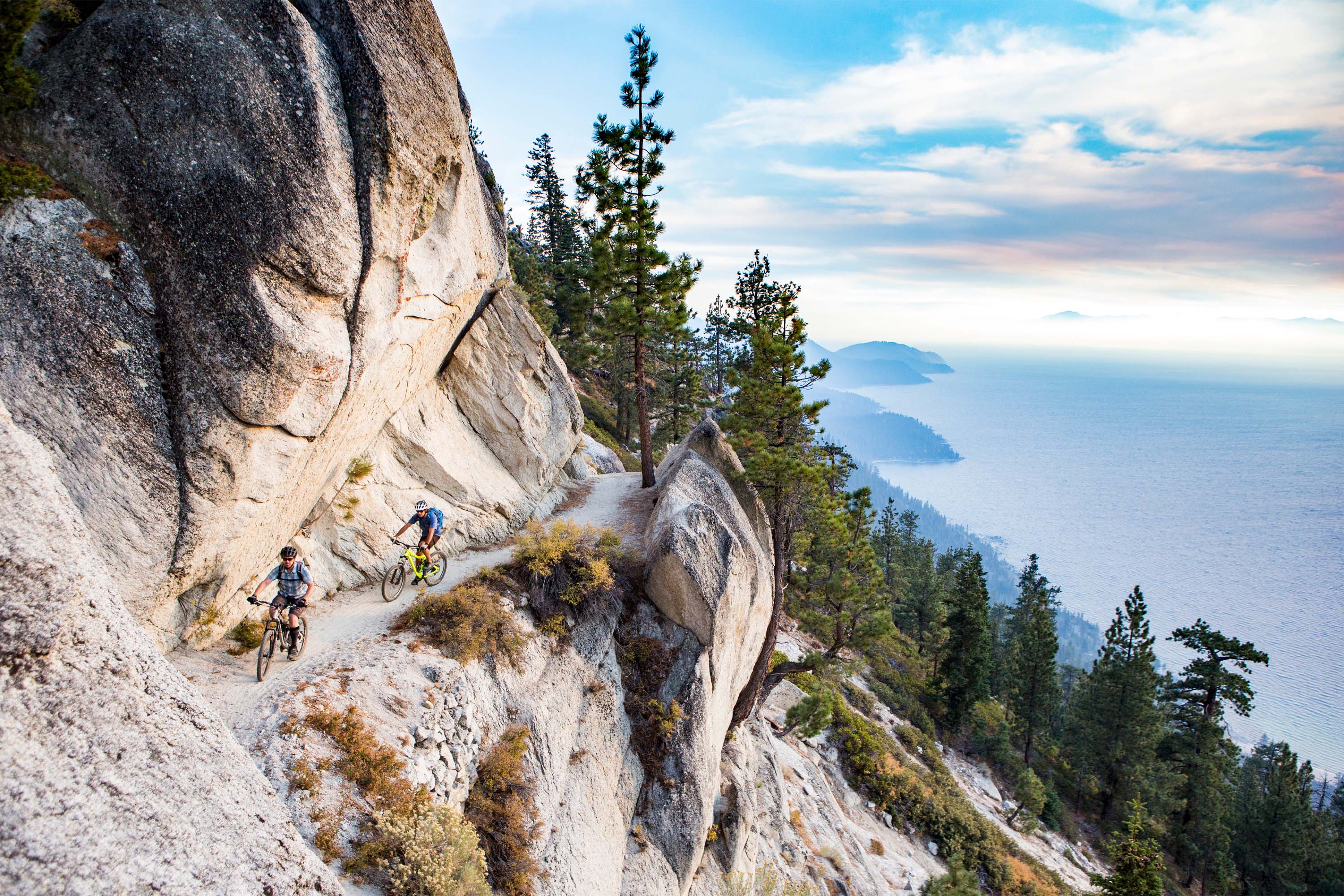 A pair of mountain bike riders on the Flume Trail above Lake Tahoe